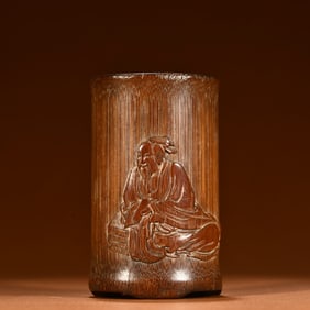 An old bamboo carving reading old man pen holder