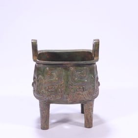 A bronze four-legged furnace