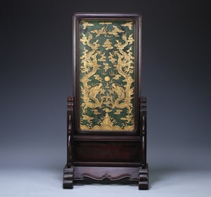 A piece of Qing Dynasty red sandalwood inlaid with jasper, depicting gold, double dragons, playing