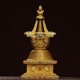 A piece of bronze gilt inlaid gemstone stupa