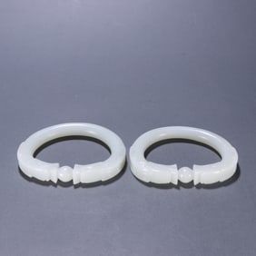 A pair of Qing Dynasty Hetian jade two dragon play bead bracelets