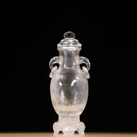 A crystal with a ring in a bottle