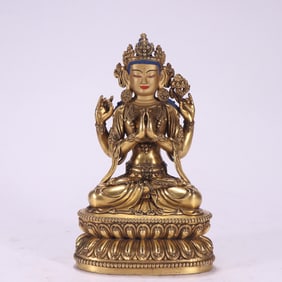 A Ming Dynasty Yongle Buddha bronze gilt four-armed Guanyin
