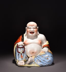 A sitting-up statue of Maitreya Buddha painted in pastel