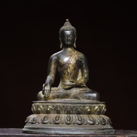 A bronze gold statue of Amitabha Buddha