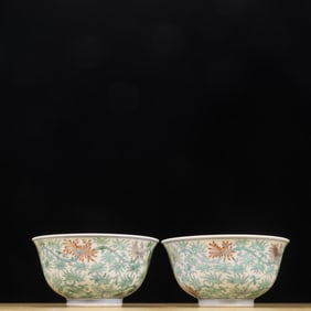 A pair of bowls with colored entwined branches