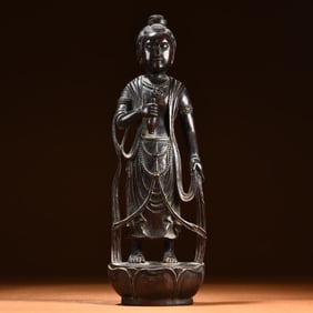 A Qing Dynasty rosewood standing statue of Guanyin