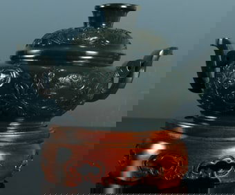 A piece of Hetian jasper entwined with floral pattern incense burner