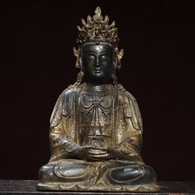 A bronze gold Guanyin Buddha statue