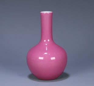 A Qing Qianlong carmine glazed celestial globe bottle