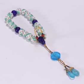 A Qing Dynasty glazed carved flower eighteen sons are handheld