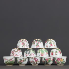 A set of enamel painted gold twelve flower god cups