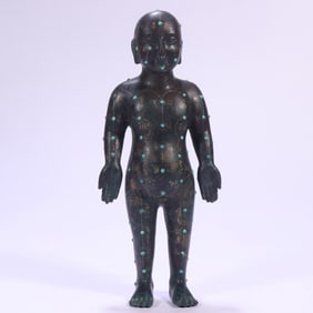 A bronze inlaid turquoise acupuncture man