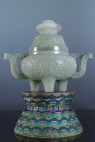 A piece of Hetian jade entwined flower pattern three-legged furnace