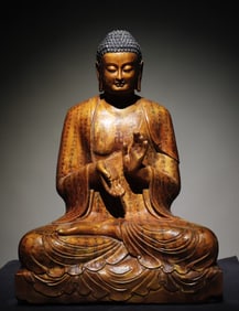 A gilt painted Buddha statue of Tang bluestone