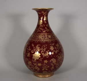 A piece of Qing Qianlong Ji red glaze depicting gold flower fruit pattern jade pot spring