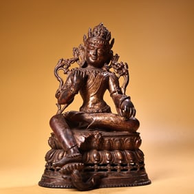A piece of pure copper in the countryside is engraved with a Tibetan gilt green Tara Buddha statue