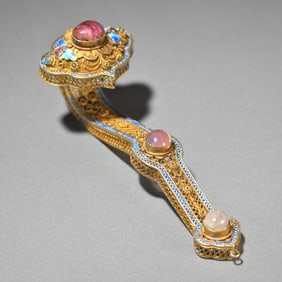 A piece of reflux silver-gilt burnt blue set with gemstones