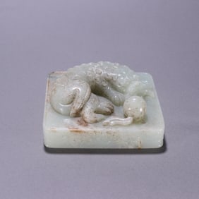 A piece of Hetian jade lion play ball seal