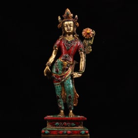 A piece of gem-encrusted gemstone painted gold Tibetan Tantra station Tara