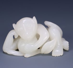 A piece of Hetian jade spirit monkey dedication carving