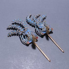 A pair of Qing Dynasty silver-gilt dotted emerald phoenix hairpins