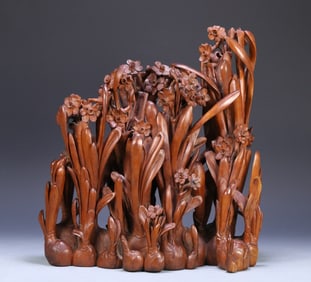 A Qing Dynasty sandalwood carved daffodil ornament