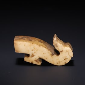 A piece of ancient jade with a hook