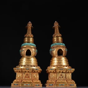A pair of Qing Dynasty bronze gilt inlaid gemstone pagodas