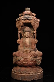 An ancient temple collects an old wood carving and painted three-sided Western holy Buddha statue