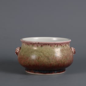 A piece of cowpea red glazed double animal ear incense burner made in the Kangxi year of the Qing