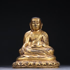 A piece of bronze gilt Guru Buddha