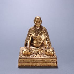 A piece of bronze gilt Guru Buddha
