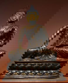 A Qing Dynasty seated statue of Shakyamuni with an alloy copper clay gold face