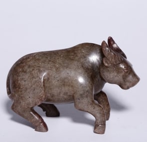 A piece of Hetian jade with Qin ox handle