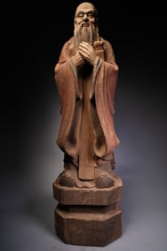 A collection of old wood carvings painted Confucius statues