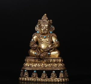 A Qing Dynasty bronze gilt inlaid turquoise yellow God of Wealth seated statue