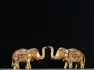 A pair of Qing bronze gilt auspicious elephant treasures