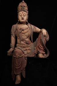 An old wood carving painted Buddha statue of Guanyin Bodhisattva