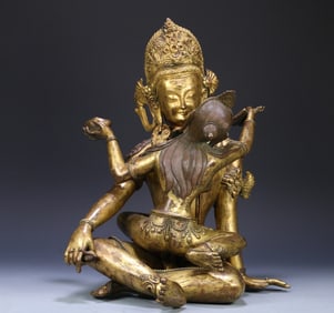 An 18th-century Tibetan bronze gilt statue of the Buddha of Joy