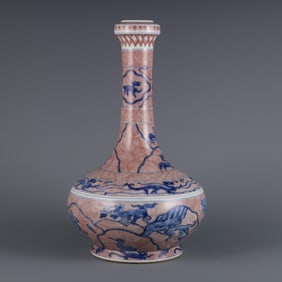 A long-necked bottle with blue and white glaze red sea monster pattern made in the Kangxi year of