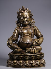 A Qing Dynasty bronze inlaid silver and yellow statue of the God of Wealth