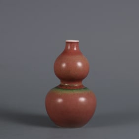 A cowpea red glazed gourd bottle made in the Kangxi year of the Qing Dynasty
