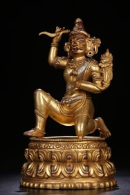 A Qing Dynasty bronze gilt inlaid silver statue of the Ming King