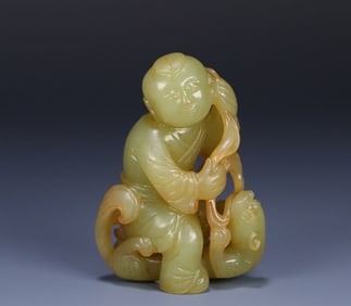 A Hetian topaz boy carving