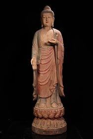 An old wood carving painted station Shakyamuni Buddha statue