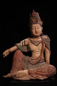 An old wood carving painted Buddha statue of Guanyin Bodhisattva