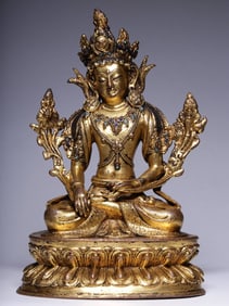 A Qing Dynasty bronze gilt green Tara seated statue