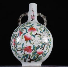 A piece of clear pastel shou peach amphora flat bottle