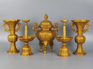 A set of five offerings of copper gilt